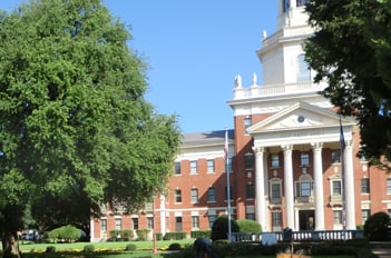 Large brick building on a campus.